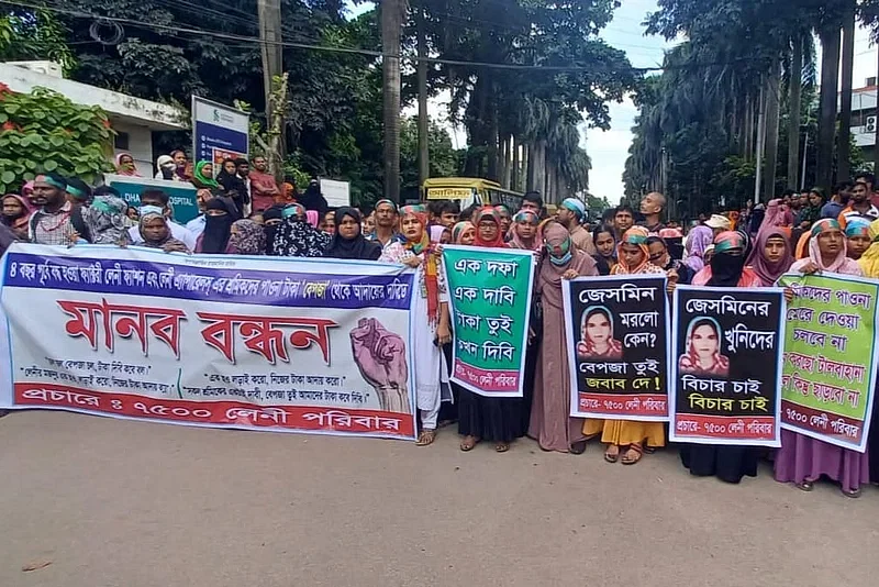 Workers of ‘Leni Fashion’ and ‘Leni Apparels’ readymade garments that shut down four years ago, formed a human chain inside the main gate of Dhaka Export Processing Zone demanding their due salary and allowance to be paid. Photo taken from Ashulia area of Savar in Dhaka on 9 September 2024.